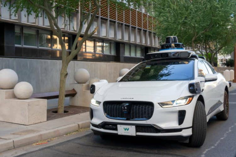 A Waymo’s self-driving Jaguar electric car on the road. Phoenix, Arizona, USA.