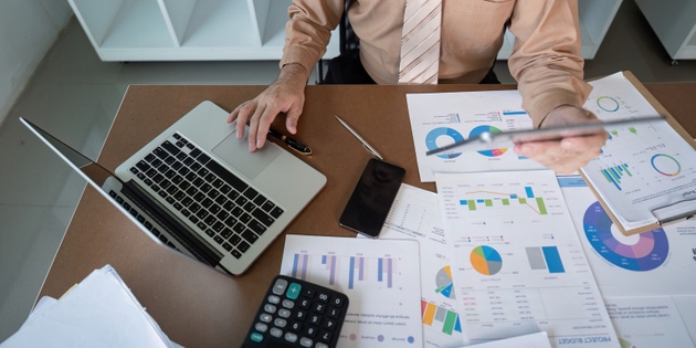 Analyzing financial data office setting business report contemporary workspace overhead view strategic insights for growth