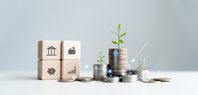 Stack of growth coins Annual financial plan for saving money, budgeting, taxes, investing, finances, savings, and New Year"s retirement ideas.