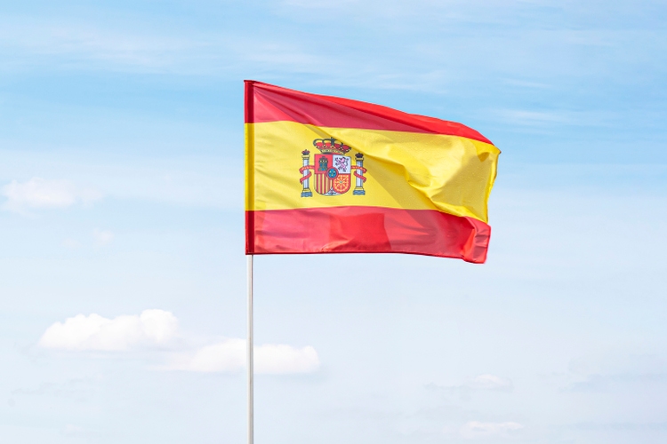 Spain flag on blue sky with clipping path. close up waving flag of Spain. flag symbols of Spain.