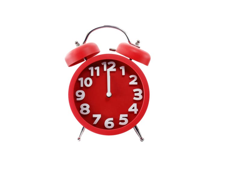 minimalist red alarm clock isolated on white background