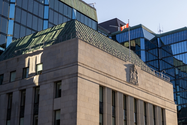 Bank of Canada building with Canadian flag in Ottawa downtown