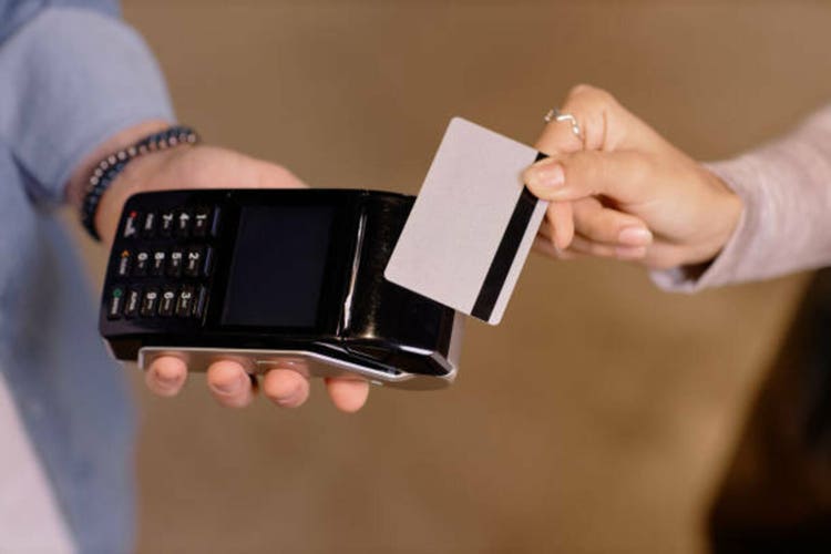 Swiping Credit Card Using Payment Terminal Gadget