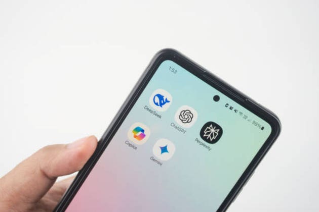 Hand Holding Smartphone Showing AI Applications Interface. Deepseek, ChatGPT, Copilot, Gemini, and Perplexity