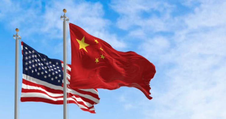 China and the United States national flags fall into the wind during a simple day
