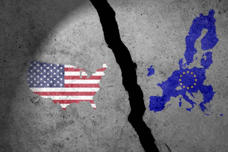 USA and EU flags on a concrete wall. USA and European union crisis