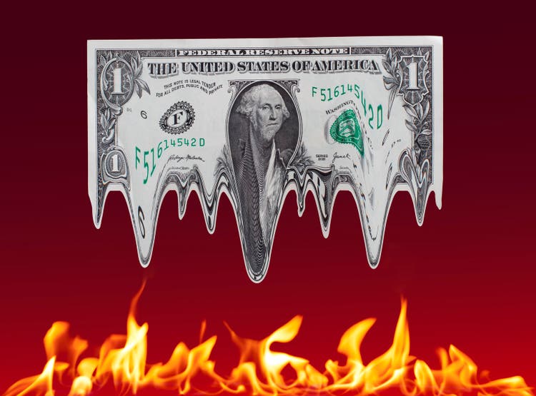 Melting dollar over fire