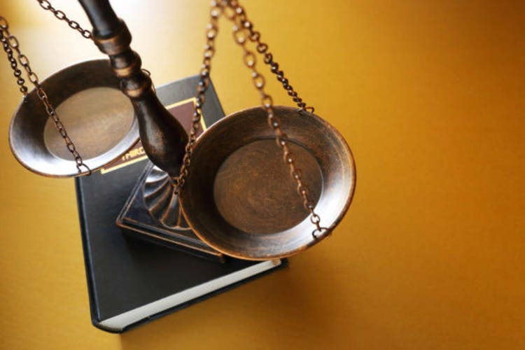 Justice Scale On Law Book