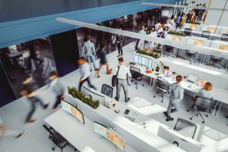 Busy office environment with people in motion