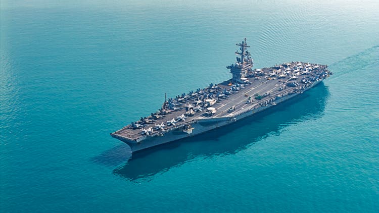Aerial view aircraft carrier at sea.