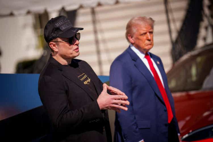 President Trump speaks alongside Tesla vehicles in the White House