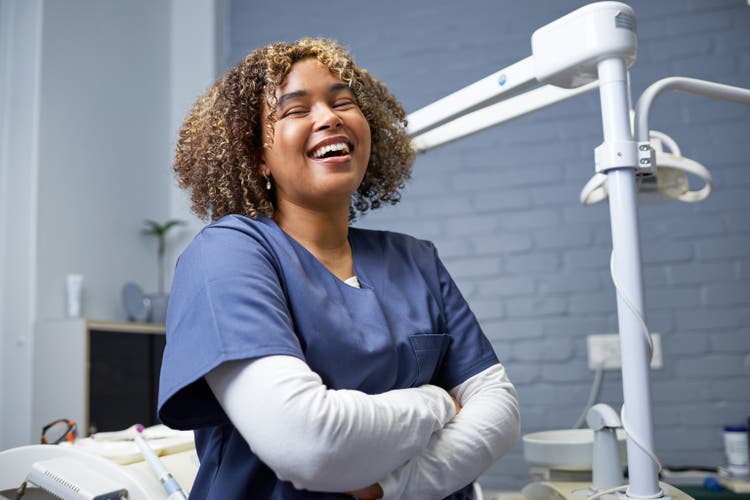 Smiling Healthcare Professional in a Dental Clinic Setting