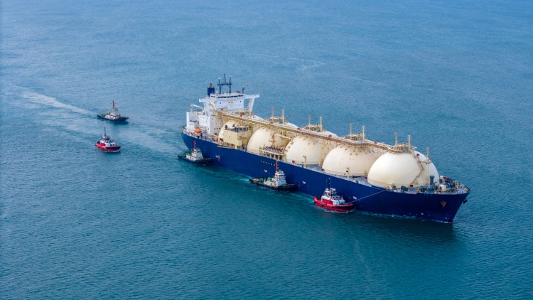 A liquefied natural gas (LNG) tanker is moored in gas tanks at a gas storage terminal. Crude oil and gas tanker ship. LPG in Tanker Bay Petroleum Chemical or methane shipping import and export transportation