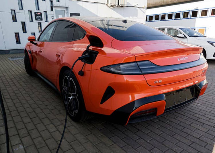 Xiaomi SU7 electric car parked on charging power station