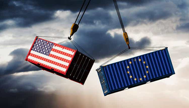 Transatlantic Tensions: U.S. and EU Flag Shipping Containers on Collision Course Beneath Stormy Sky