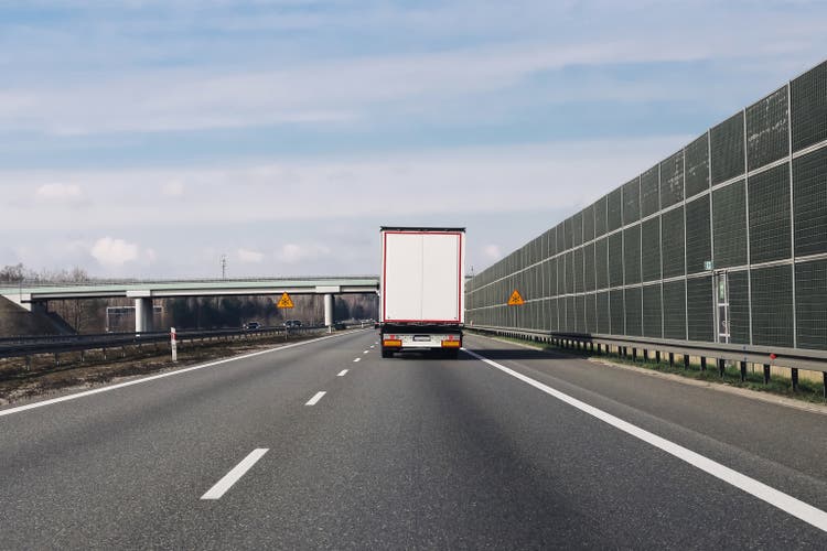 Truck on highway. Fast cargo transport. Logistics in motion. Road freight delivery. Long distance drive.