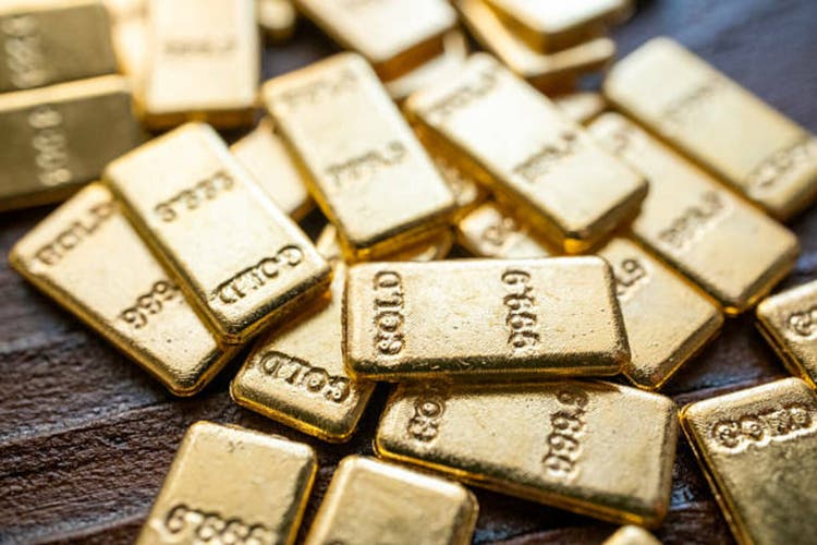gold bars on brown background