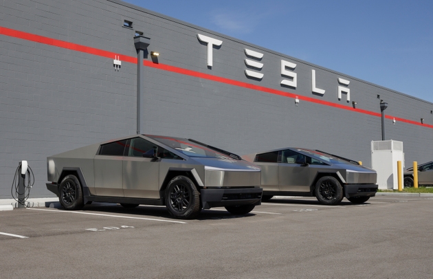 Tesla Cybertruck display at a dealership. Tesla offers the Cybertruck with driving range of up to 334 miles. MY:2025