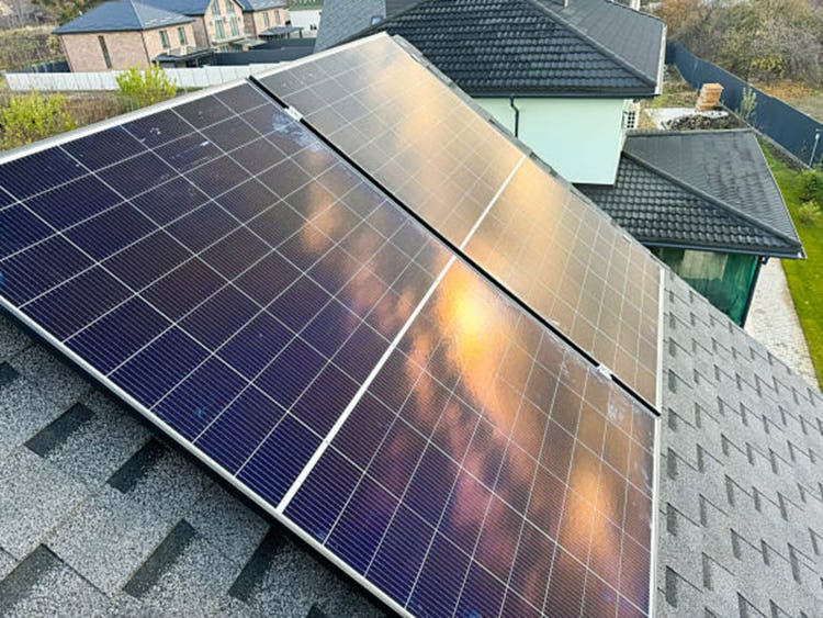Energy-efficient house with solar panels on the rooftop