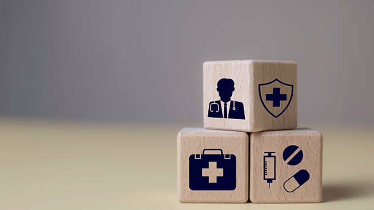 Life and Health Insurance Coverage medical Care and Protection Services healthcare support in wooden blocks, doctor access, and comprehensive insurance plans for personal well-being and peace of mind.