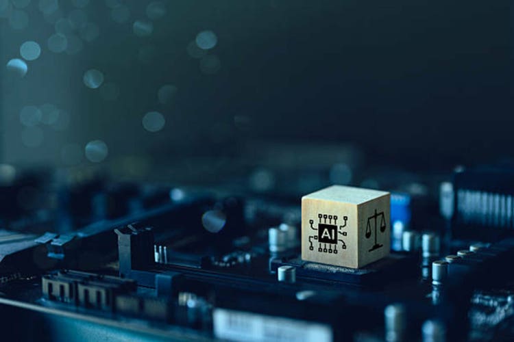 AI Laws and Regulations Concept. Wooden cube with AI and law icons on the Computer motherboard. regulation, standard and business policy. Laws to ensure that AI is safe, transparent, and traceable.