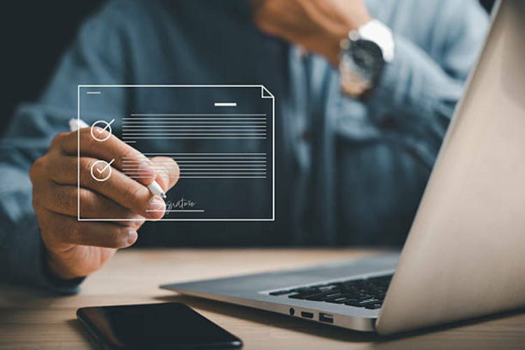Efficient document management Businessman uses pen to sign electronic documents on virtual screen