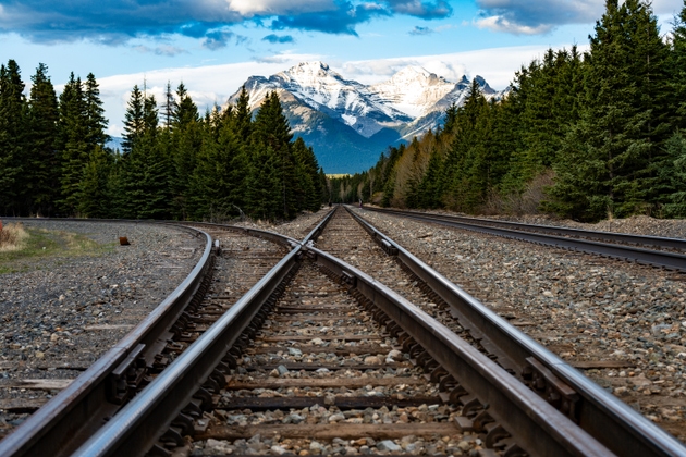 Railways with a mountains in a background - stock Photography