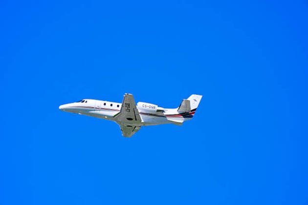 Private jet Netjets Europe type Cessna Citation XLS registration CS-DQB at Swiss Airport Zürich Kloten on a sunny spring day.