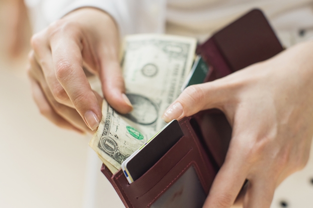 One dollar bill in wallet
