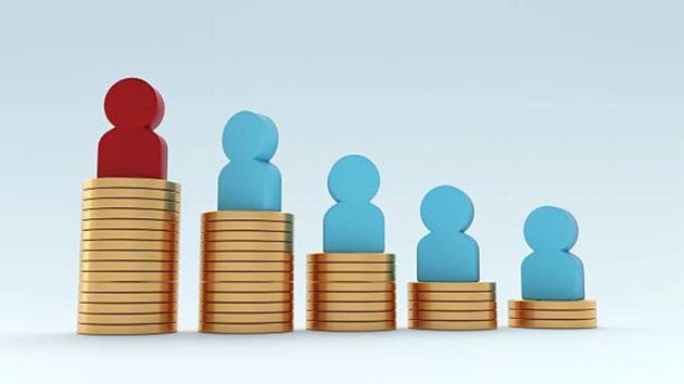 A stacks of golden coins with dollar sign symbol and human-shaped figurine.