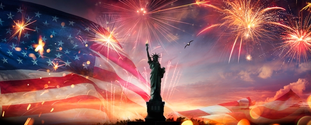 American Flag With Fireworks And Statue of Liberty In Abstract Skyline