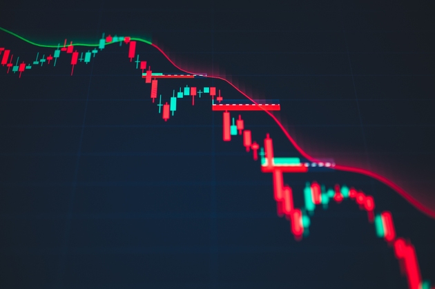 Bearish financial chart with red trend line and market downturn data on digital screen for stock trading analysis