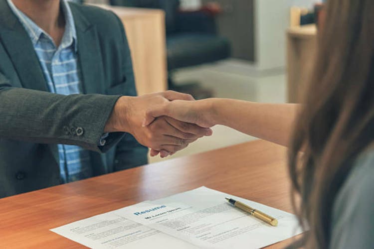 Team Business Partners shaking hands together to Greeting Start up small business in meeting room. Shakehand teamwork partners at modern office handshake together. Business mergers and acquisitions