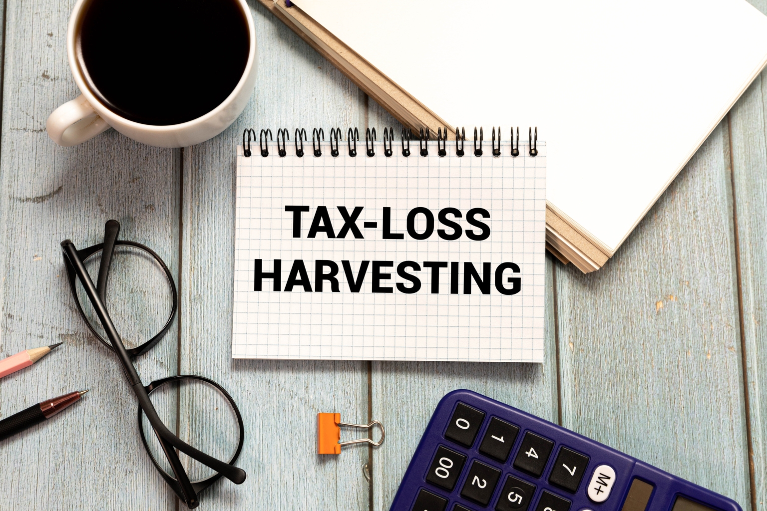 Tax Loss Harvesting. notepad on a gray background. text on white paper