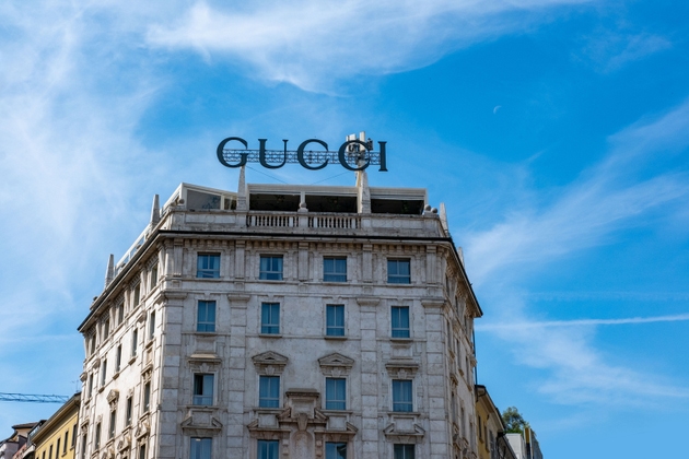 Gucci store front in Milan, elegant window display, luxury shopping, fashion destination, classic architecture, Milan, Italy - May 21, 2025