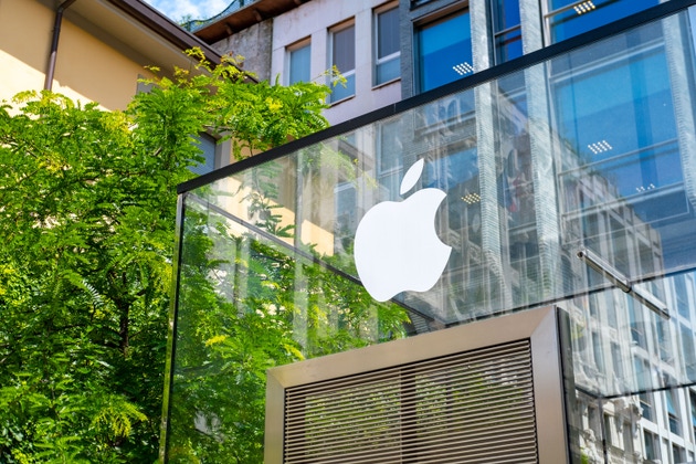 White Apple logo on glass, office window, modern tech store shop, sleek branding, iconic symbol, Milan, Italy - May 21, 2025