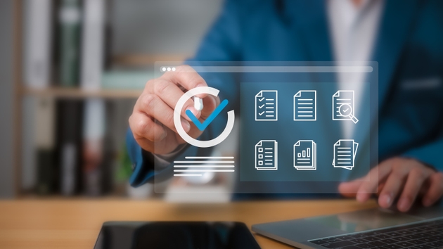 Businessman checklist and filling survey form online, Audit business concept, Compliance with internal organization financial services regulation, Examination for business and financial management.