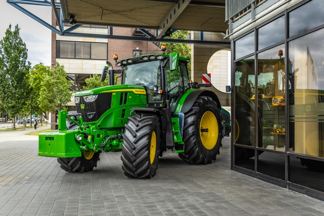 Tractor of John Deere in Mannheim, Germany. American corporation manufacturing agricultural machinery, heavy equipment, forestry machinery and lawn care equipment