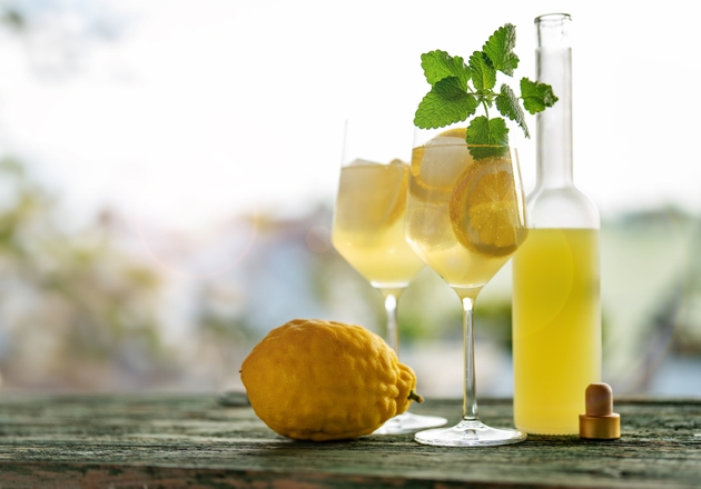 Limoncello liqueur with ice cubes in glasses
