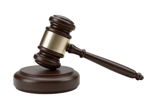 Isolated Wooden Gavel on Sounding Block for Legal Proceedings
