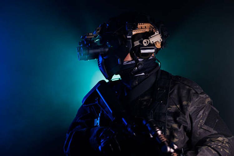 Special forces soldier equipped with night vision goggles and tactical gear