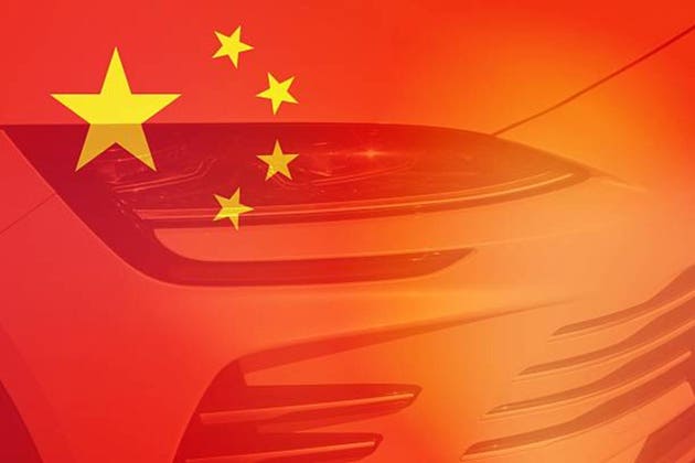 Close up view of a car with Chinese flag as backgrond.