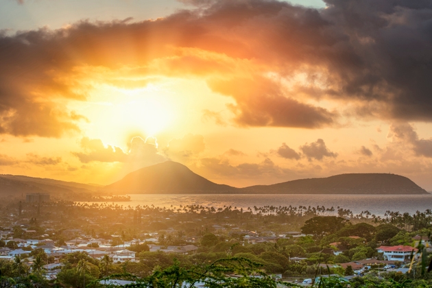 Coastal Town at Sunset with Mountain Backdrop and Ocean View in Oahu, Hawaii
