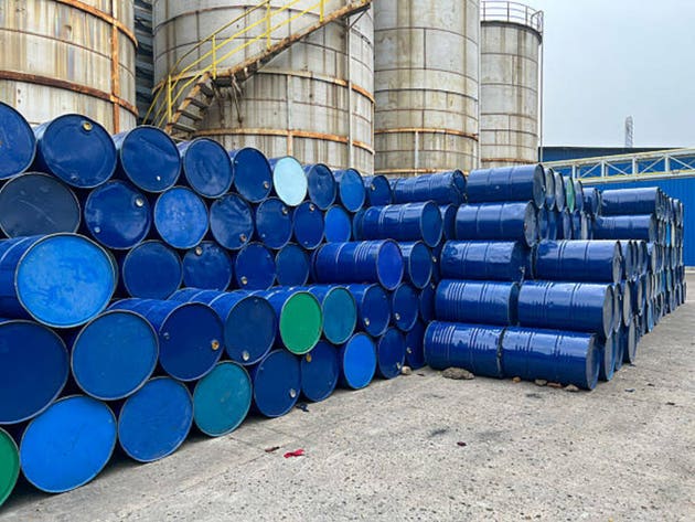 Stack of Blue Industrial Barrels Stored at a Manufacturing Facility