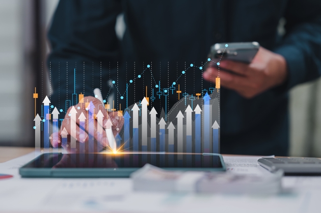 Persons Hand Holding Tablet Digital Financial Graph Analysis, Upward Chart Showing Growth, Business Interface, Stock Market Data, Smartphone Interaction