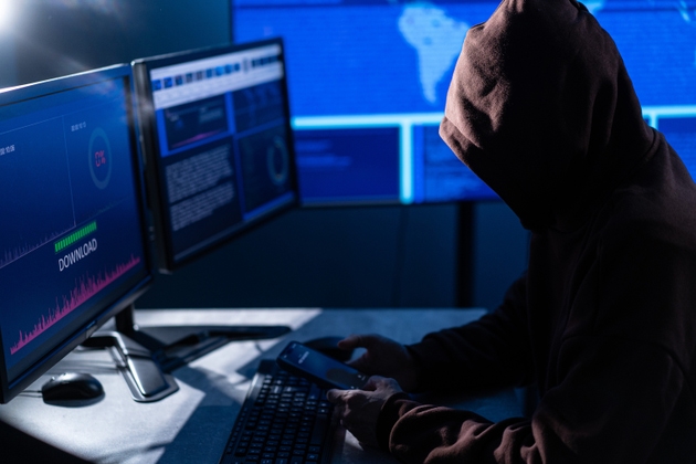 Computer hacker stealing data concept for network security, identity theft and computer crime
