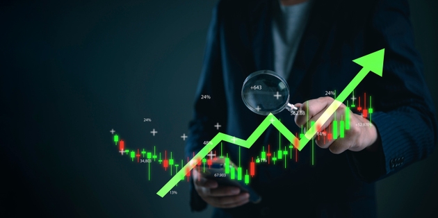 Trader using smartphone for stock exchange trading analysis. Digital finance technology for business investment growth, checking uptrend profit data on virtual candlestick chart for success.