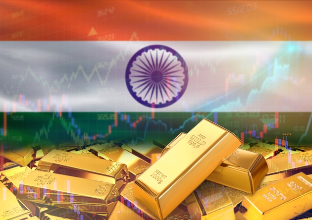 Gold bars on India flag in background. Gold bars stacked on Indian flag. Concept of India gold reserves