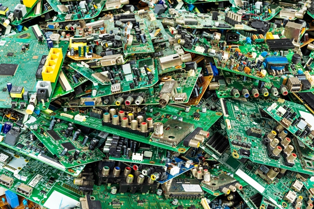 Pile of electronic waste from computer motherboards - old TV circuit boards from the recycling industry