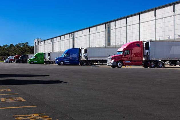 Semi trucks parked on warehouse loading dock